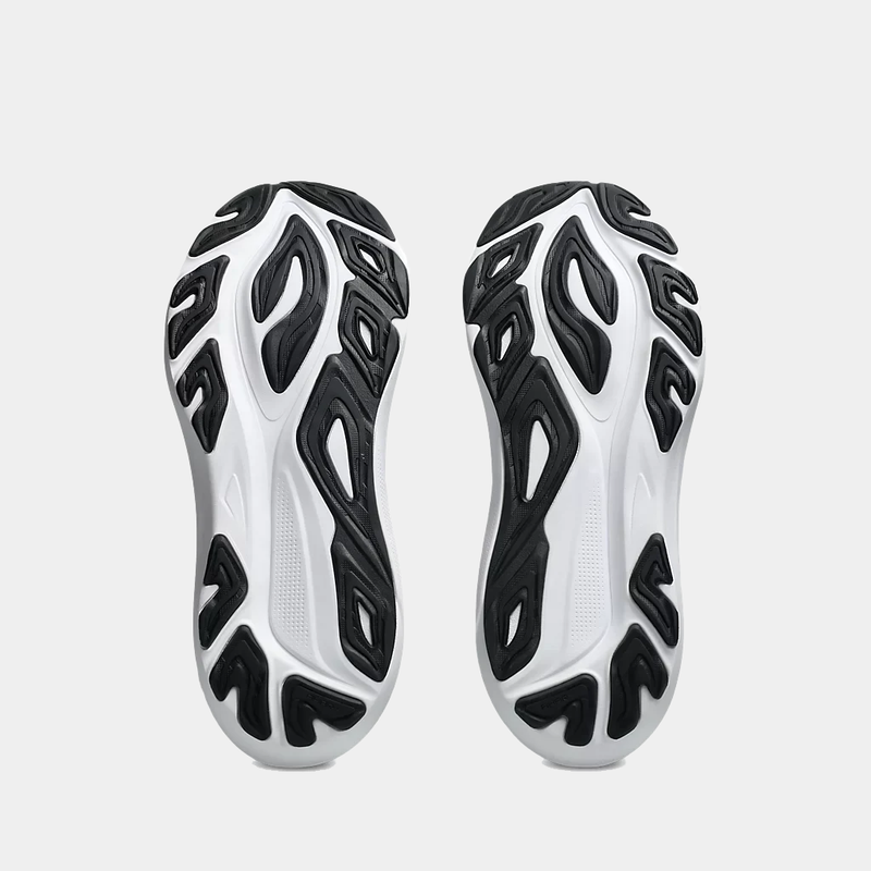 Asics GT-2000 14 running shoes outsole with black rubber traction grooves and white midsole, sole/bottom view.