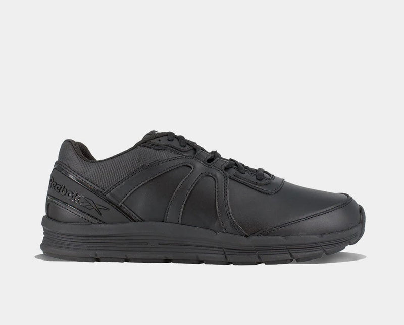 Reebok Work Guide Work shoes in all-black leather with mesh accents and slip-resistant outsole, side view.