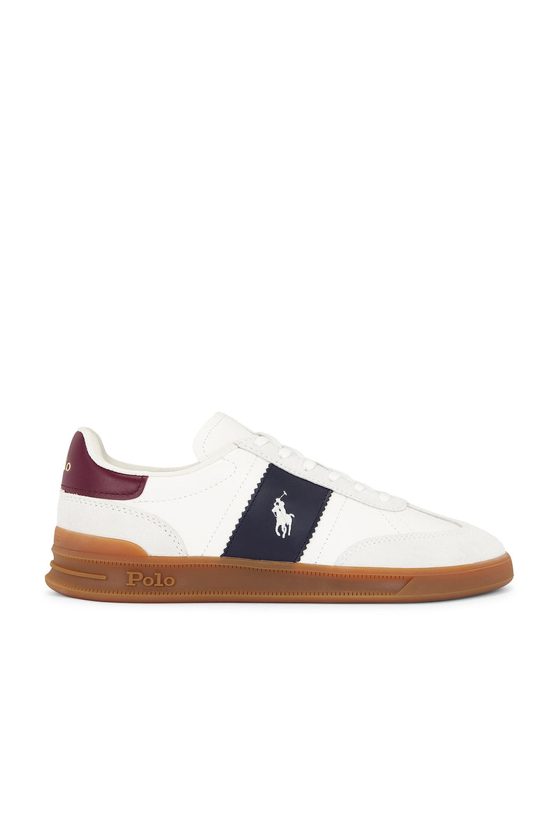 Polo Ralph Lauren Heritage Aera Sneaker, white leather with navy side stripe, maroon heel, and gum rubber sole, side view.