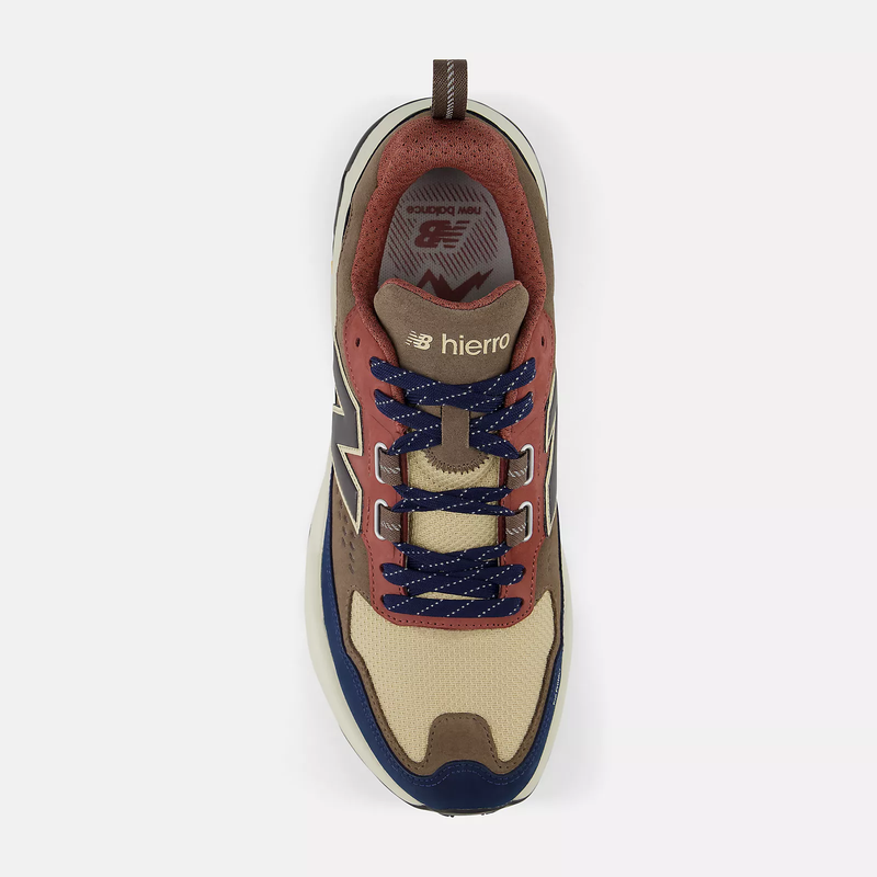 New Balance Hierro Trek trail shoe in beige, brown, and navy with mesh upper and lace system, top view.