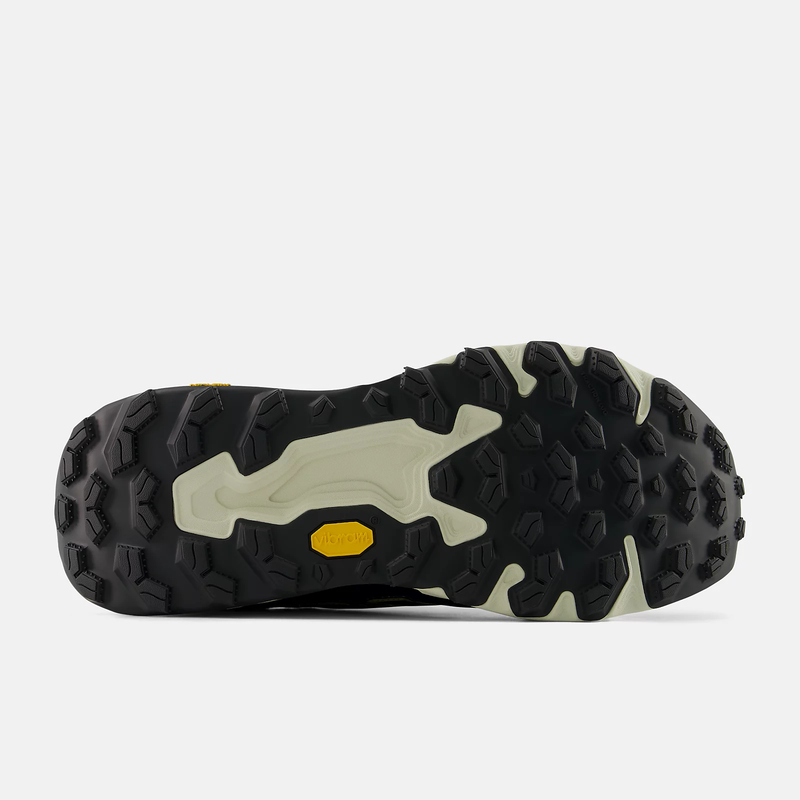 New Balance Hierro Trek hiking shoes outsole with Vibram rubber tread, black and beige with deep lugs for enhanced traction, sole/bottom view.