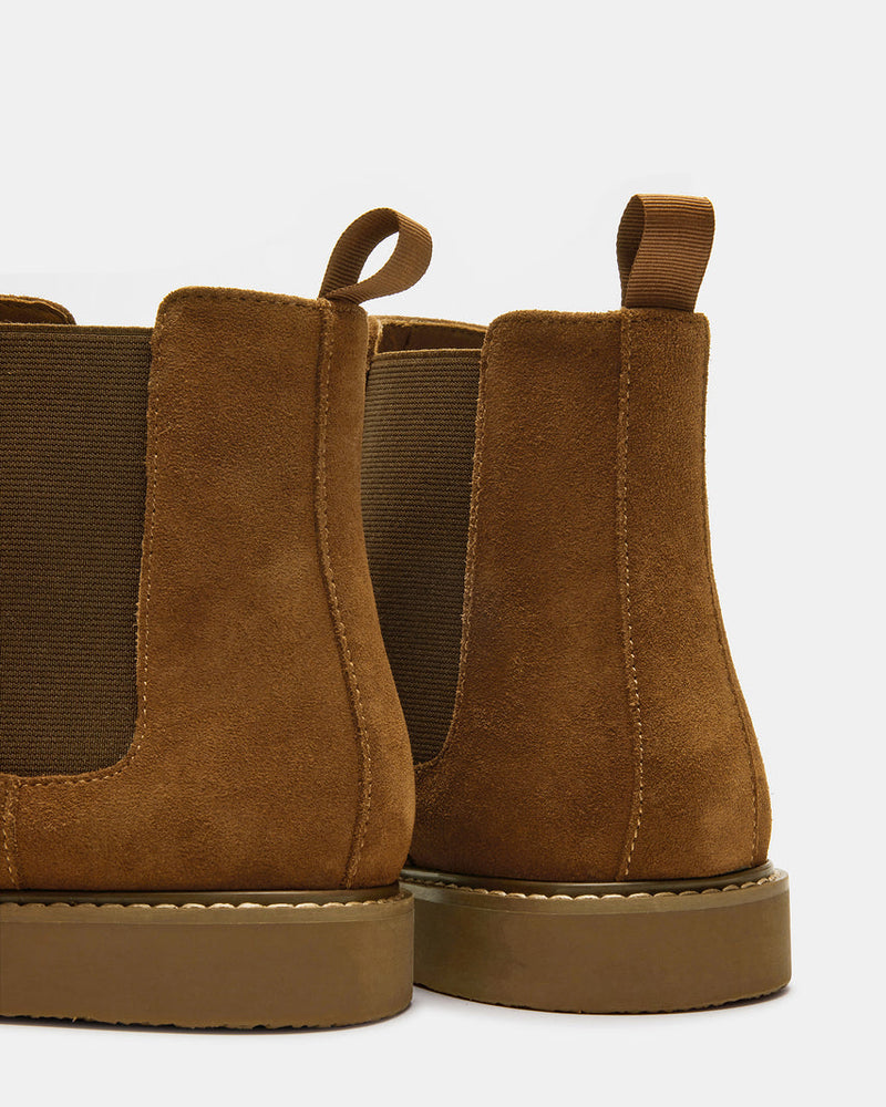 Steve Madden Highline Chelsea Boot in brown suede with elastic side panels and pull tabs, back view.