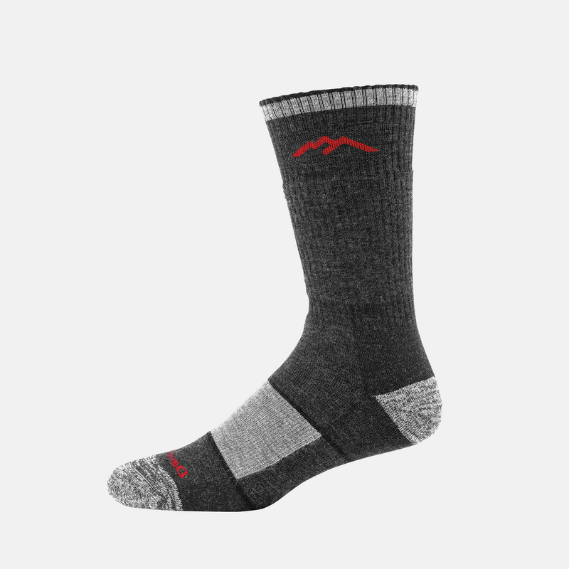 Darn Tough Hiker Boot Midweight Hiking Sock in charcoal gray with red mountain logo and reinforced heel and toe, side view.