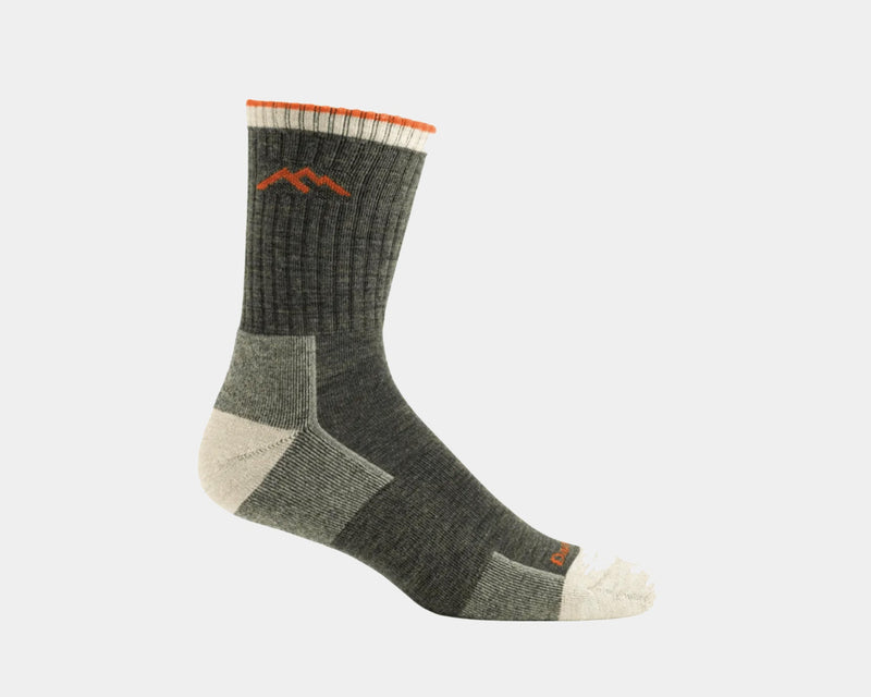Darn Tough Hiker Micro Crew Cushion hiking socks in olive green with cushioned sole, ribbed cuff, and orange mountain logo, side view.