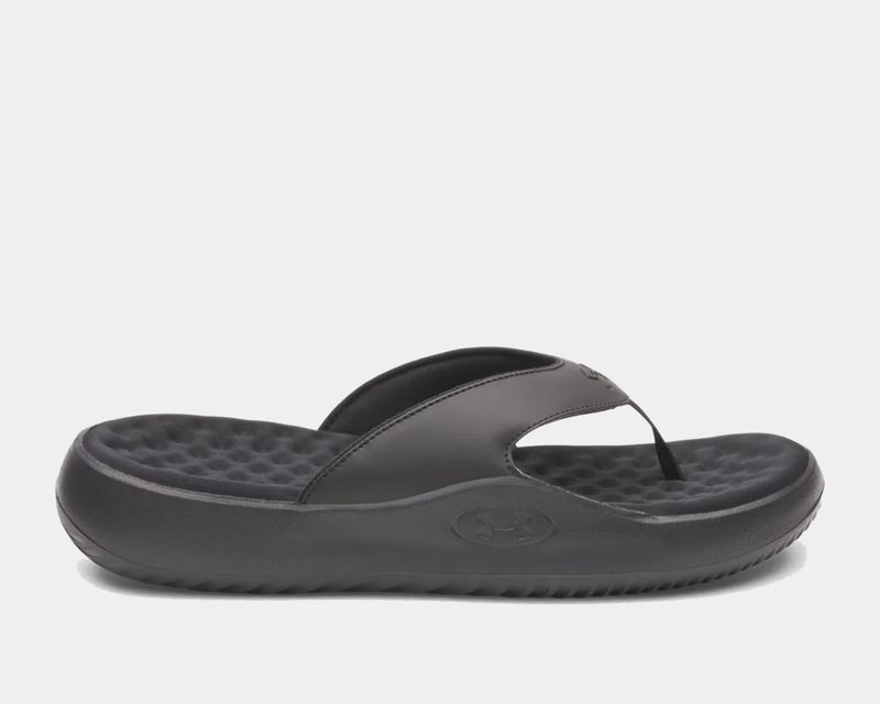 Under Armour Ignite Pro 8 T flip flops in black with cushioned footbed and textured outsole, side view.