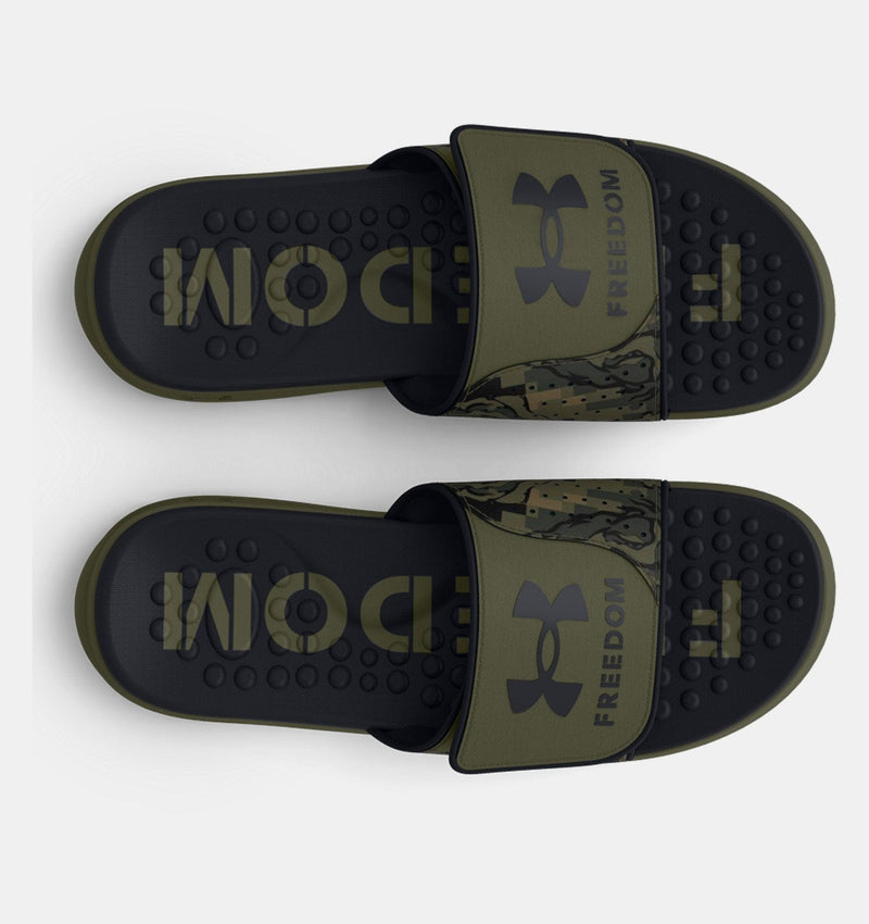 Under Armour Ignite Pro Freedom Slides, black and olive green with camo strap details and textured footbed, top view.