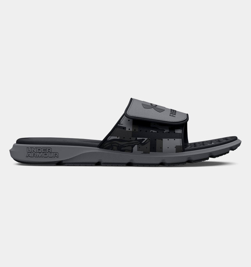 Under Armour Ignite Pro Freedom Slides, black and gray with an adjustable strap and cushioned footbed, side view.