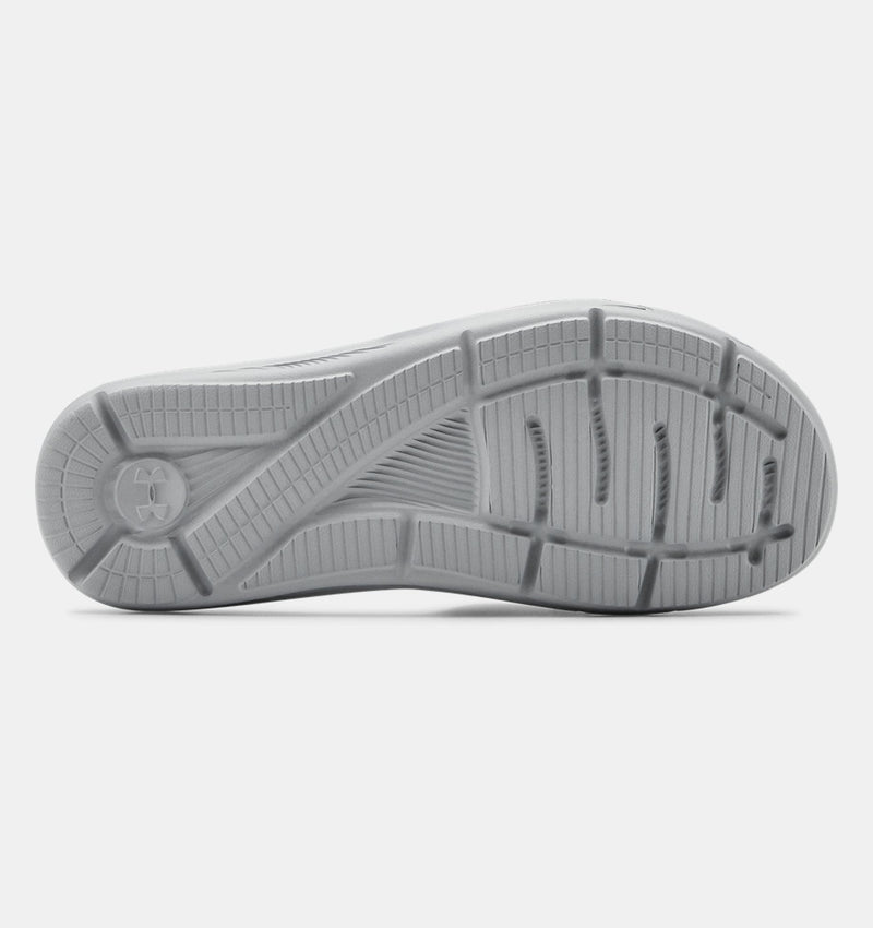 Under Armour Ignite VI SL sandal outsole in gray featuring textured tread design and logo detail for traction.