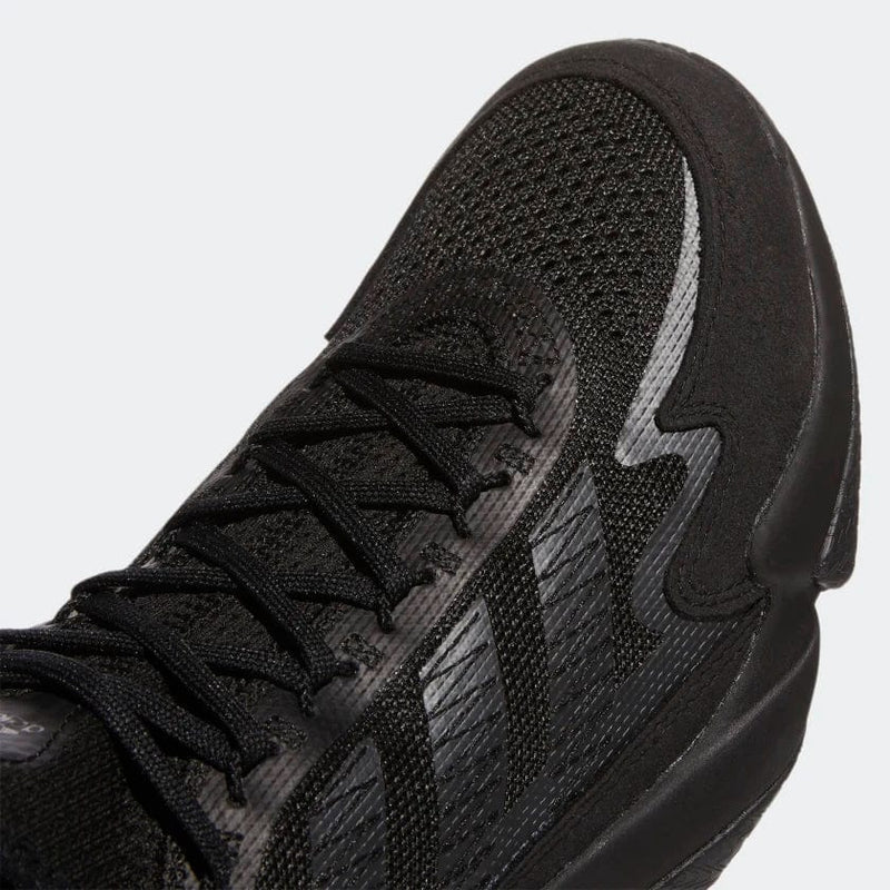 Adidas Impact FLX shoes in black with mesh upper, signature three-stripe detailing, and textured midsole, close-up top angle.