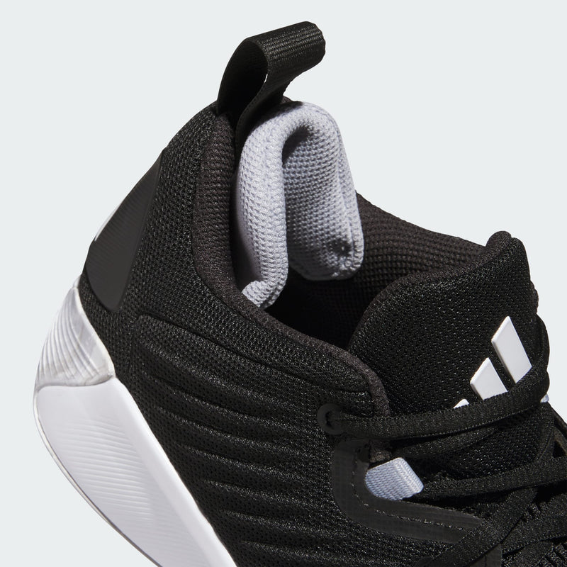 Adidas Initiation basketball shoes in black with a mesh upper, padded gray tongue, and white outsole, close-up angled view.