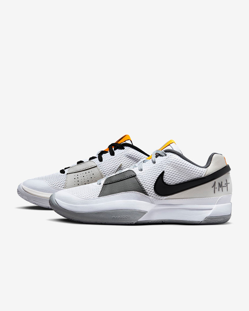 Nike Ja 1 "Wet Cement" basketball shoes in white, gray, and black with mesh uppers and signature detailing, side view.