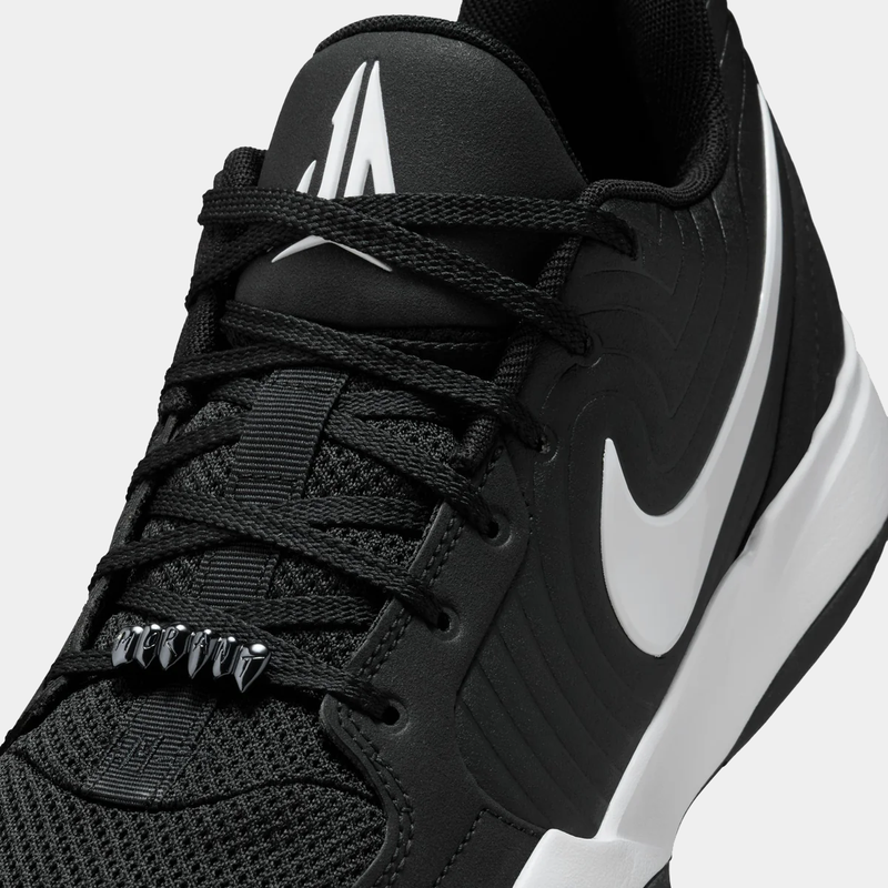 Nike Ja 2 basketball shoes in black and white with mesh upper, textured overlays, lace detailing, and side logo, close-up view.