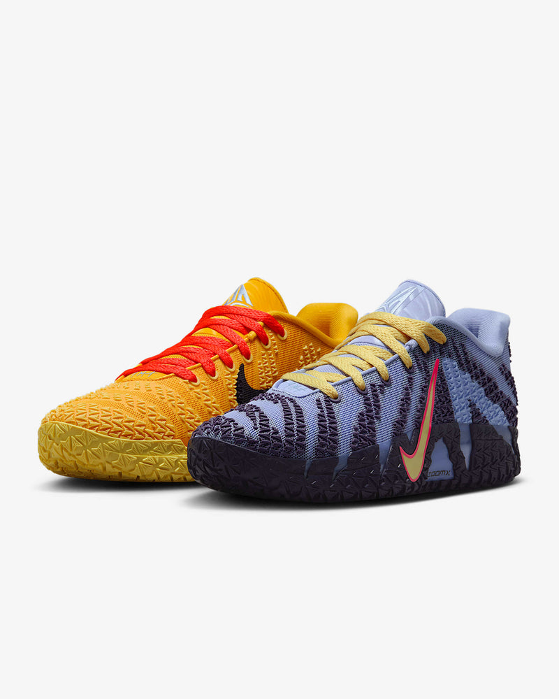 Nike Ja 3 "Channel 12" basketball shoes with mismatched colorways, featuring textured yellow and orange design on the left shoe and purple and light blue design on the right shoe.