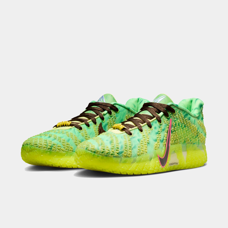 Nike Ja 3 "Halloween" basketball shoes in bright green and yellow with textured mesh upper, brown laces, and signature Nike Swoosh, front angle view.