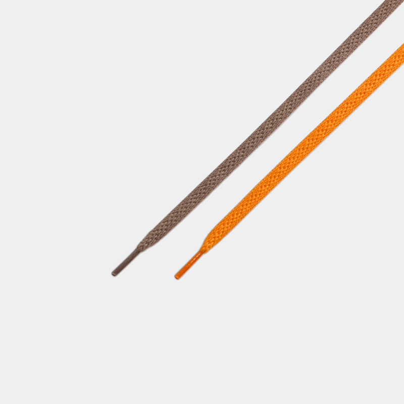 "Nike Ja 3 'Mink Brown' laces in brown and orange with woven texture and plastic aglets, close-up view"