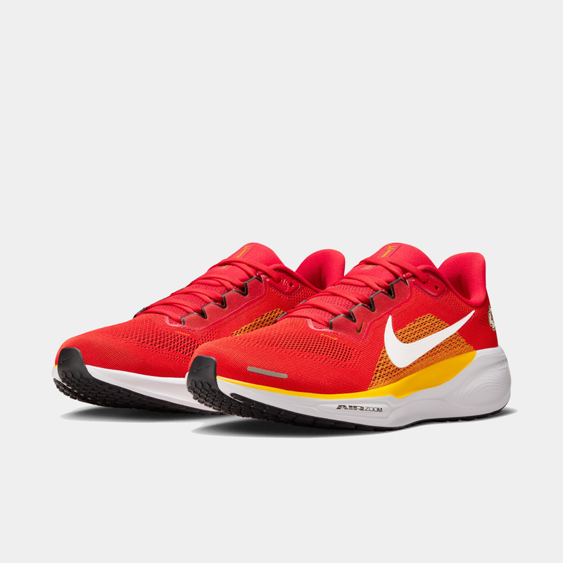 Nike Kansas City Chiefs Pegasus 41 running shoes in bold red with yellow accents, white Nike Swoosh, mesh upper, and Air Zoom cushioning, angled front view.