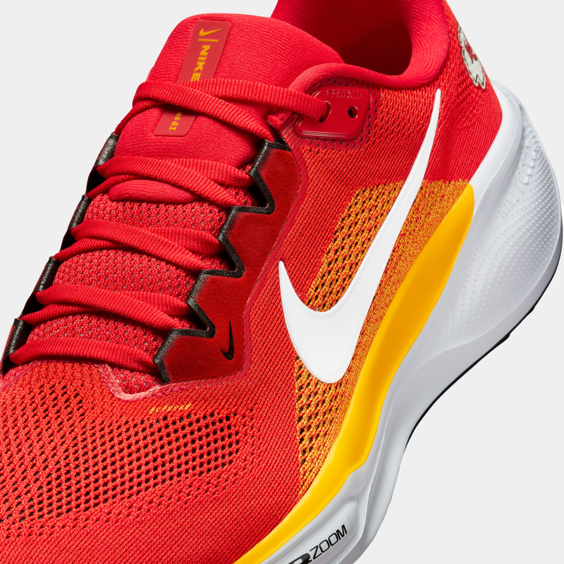 Nike Kansas City Chiefs Pegasus 41 running shoes in red, yellow, and white with breathable mesh upper and Zoom Air cushioning, angled front view.