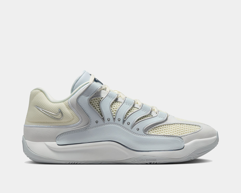 Nike KD 18 basketball shoes in pale yellow and light blue with mesh upper and cushioned sole, side view.