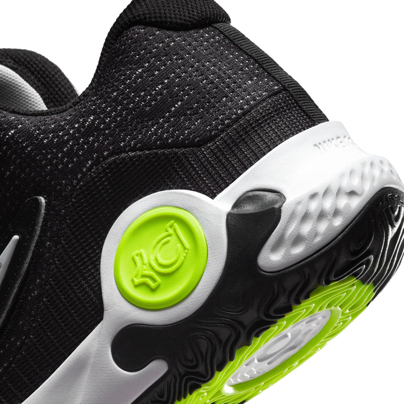 Nike KD Trey 5 X basketball shoes close-up of heel and outsole, featuring black mesh upper, white accents, and neon green rubber details.