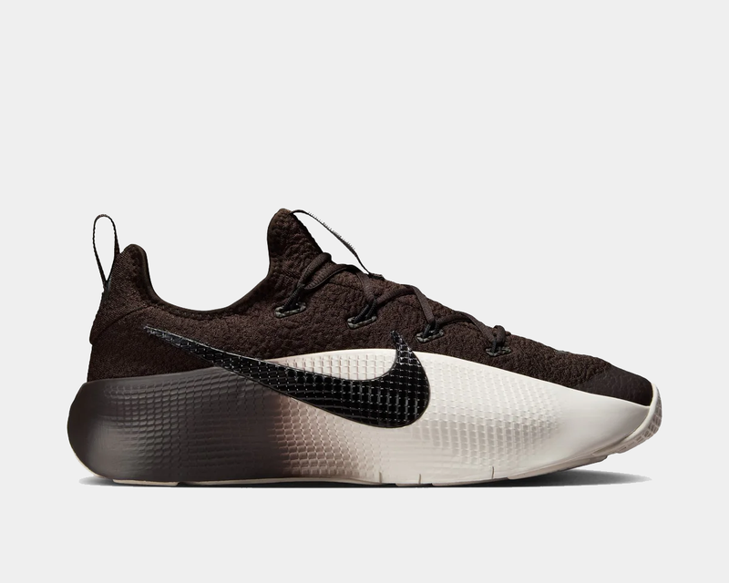 Brown and white sneaker with Nike logo on a light gray background