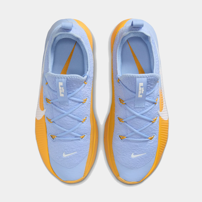 Pair of blue and orange sneakers on a white background