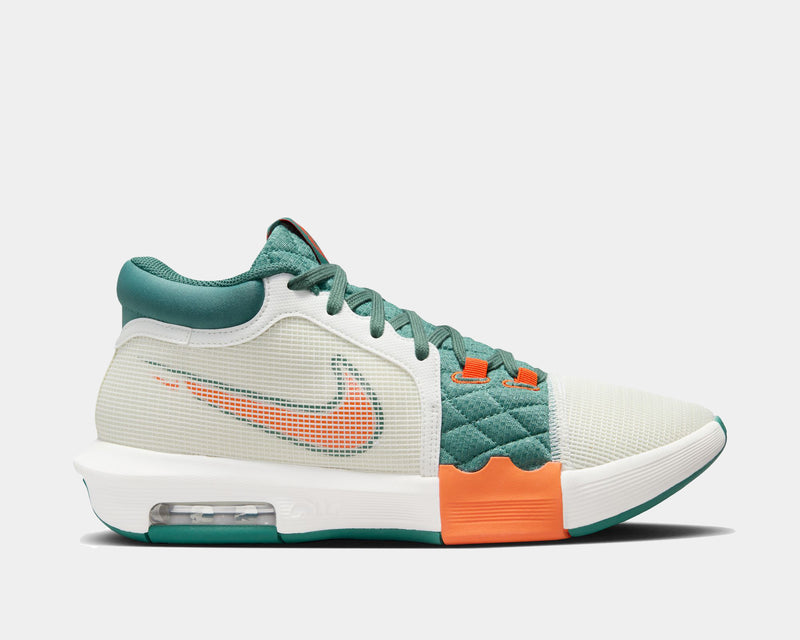 Nike LeBron Witness 8 basketball shoes, side view showing green and white mesh upper with orange accents and visible Air cushioning.