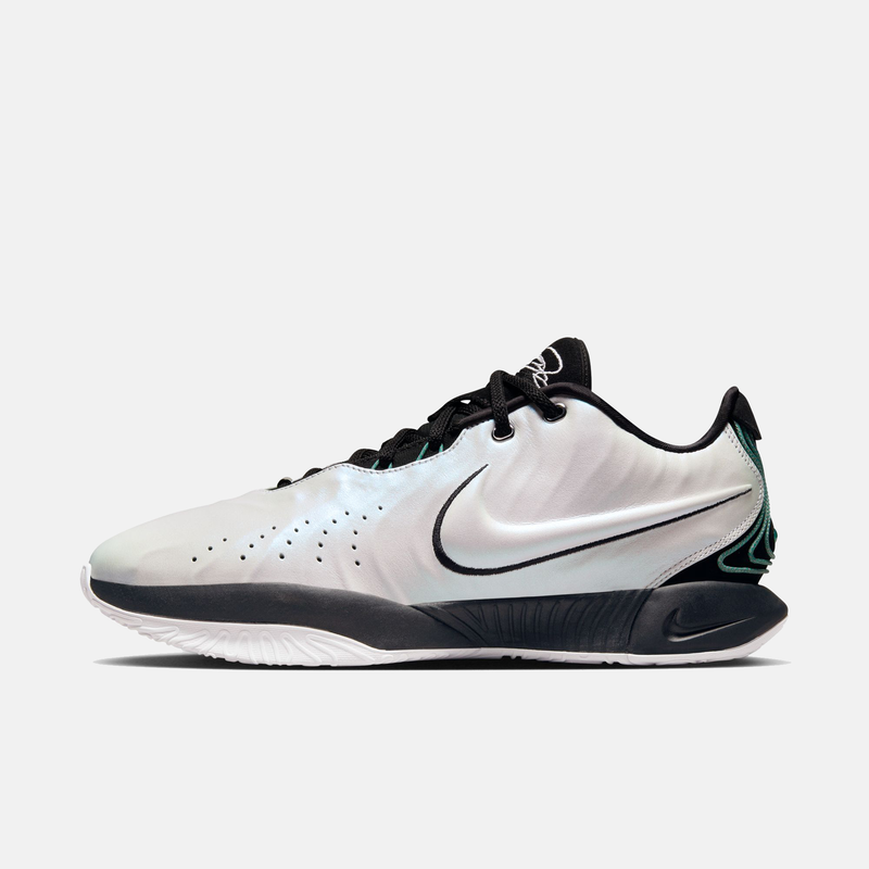 Nike Lebron XXI "Conchiolin" basketball shoes with iridescent white upper, black details, and teal accents, side view.