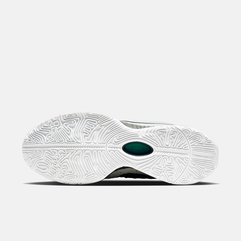 Nike Lebron XXI "Conchiolin" basketball shoes outsole with intricate white tread pattern and green midfoot insert, sole view.