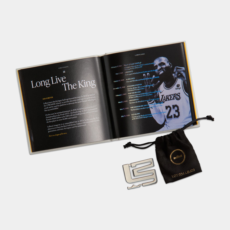 Nike LeBron XXIII "Grand Opening" collectible set featuring a commemorative booklet, branded black pouch, and metallic badge.