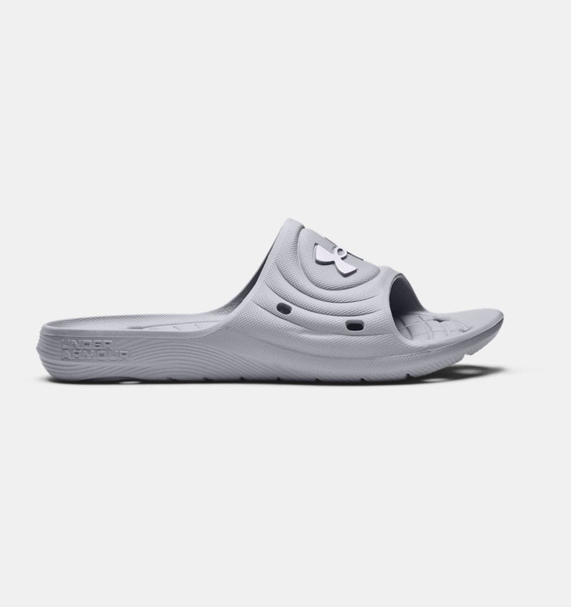 Under Armour Locker IV SL slides in light gray with textured footbed, perforated upper, and molded sole, side view.