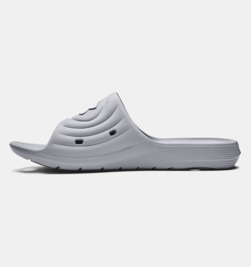 Under Armour Locker IV SL slides in light gray with contoured strap design and textured outsole, side view.