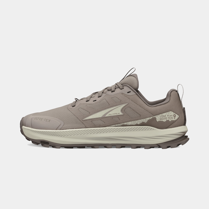 Altra Lone Peak 9 GTX trail running shoes in taupe with a GORE-TEX upper and rugged outsole, side view.