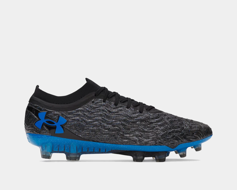 Under Armour Magnetico Elite 5 FG soccer cleats in black and blue with textured upper and lightweight studded sole, side view.
