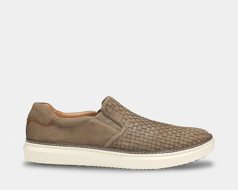 Johnston & Murphy McGuffey 2 Woven Slip-on shoes in taupe with woven leather upper, cushioned white sole, and side elastic panels, side view.