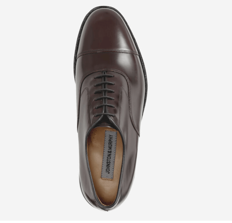 Johnston & Murphy Melton Cap Toe oxford shoe in polished brown leather with cap toe detail and lace-up design, top view.