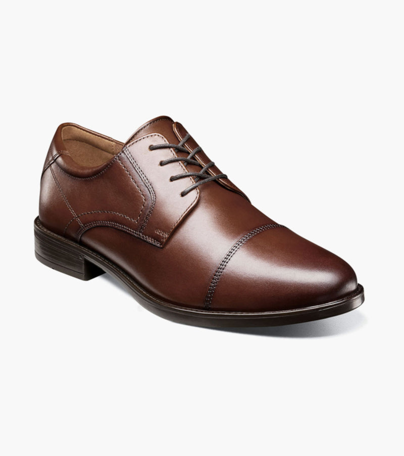Florsheim Midtown Cap Oxford dress shoe in rich brown leather with cap toe design and lace-up closure, angled front view.