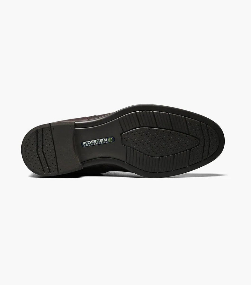 Florsheim Midtown PT Zipper Boot outsole in black rubber featuring textured grip pattern and embossed logo, bottom view.