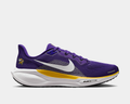 Nike Minnesota Vikings Pegasus 41 running shoes in purple with white Swoosh, Vikings logo on heel, and yellow accents, side view.