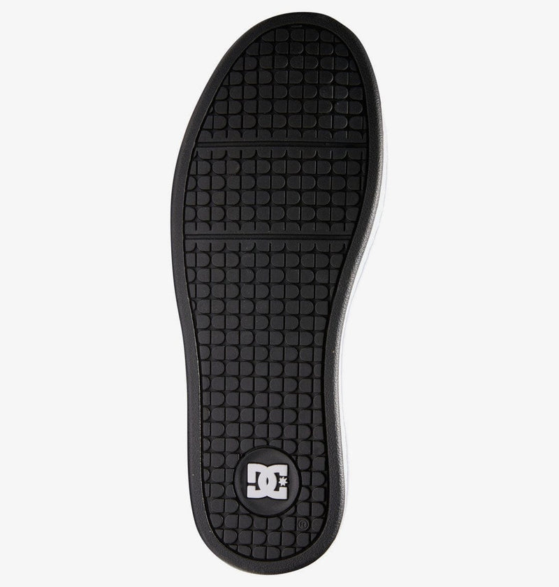 DC Footwear Net shoes outsole showing textured black rubber tread pattern and DC logo, sole/bottom view.