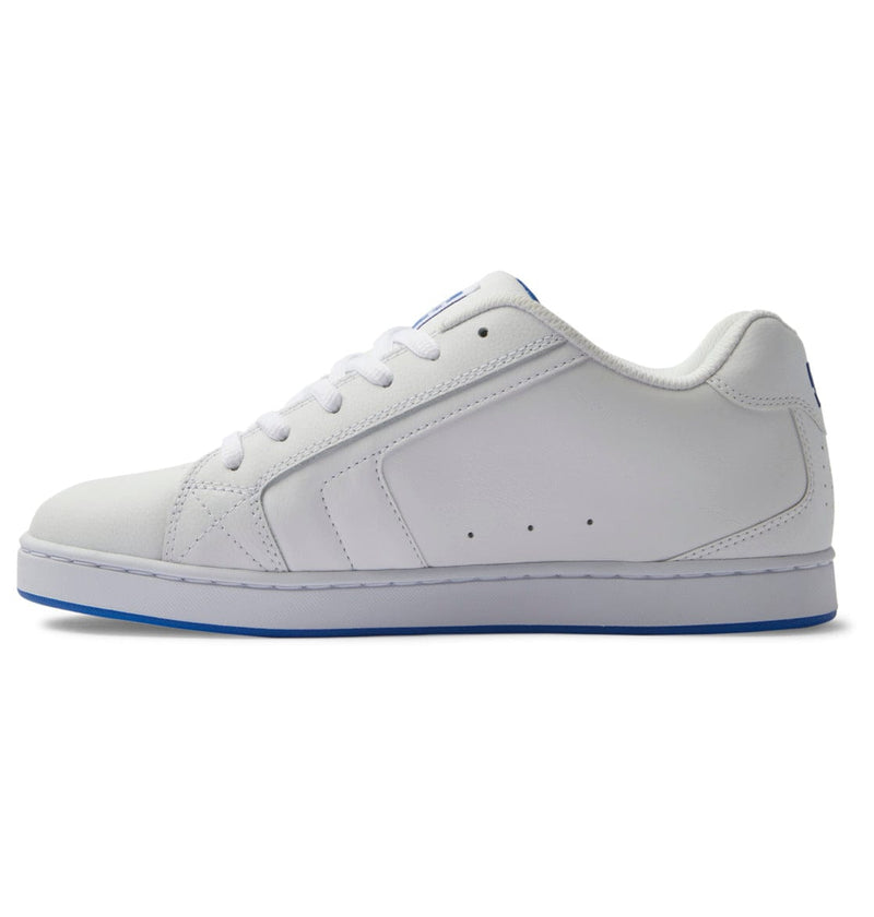 DC Footwear Net sneakers in white synthetic leather with perforations and blue accents, side profile view.