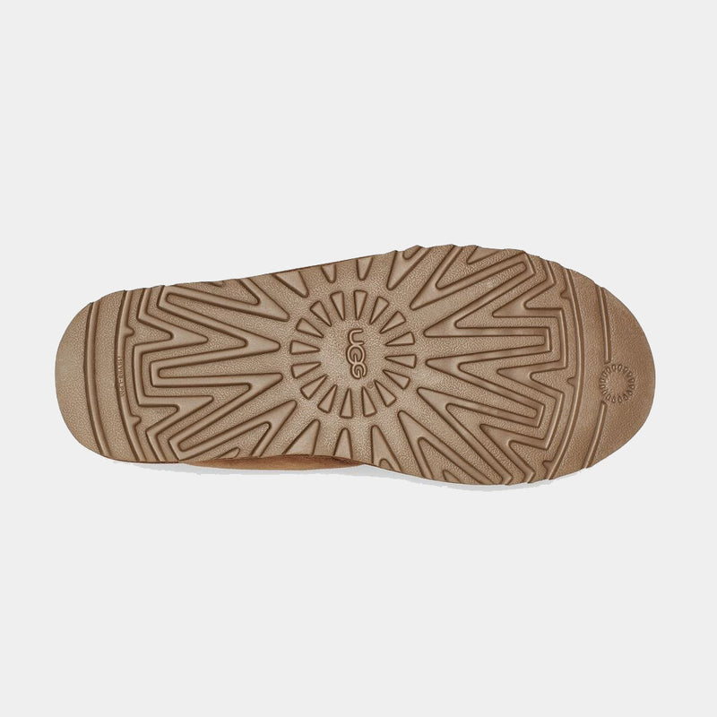 UGG Neumel Suede boot outsole in tan showing tread pattern and UGG branding, sole/bottom view.