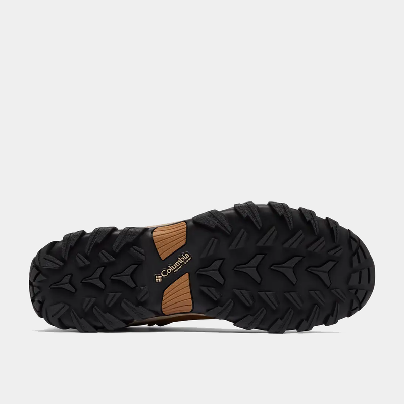Columbia Newton Explorer shoe outsole in black rubber with rugged traction patterns and branded detail, sole/bottom view.