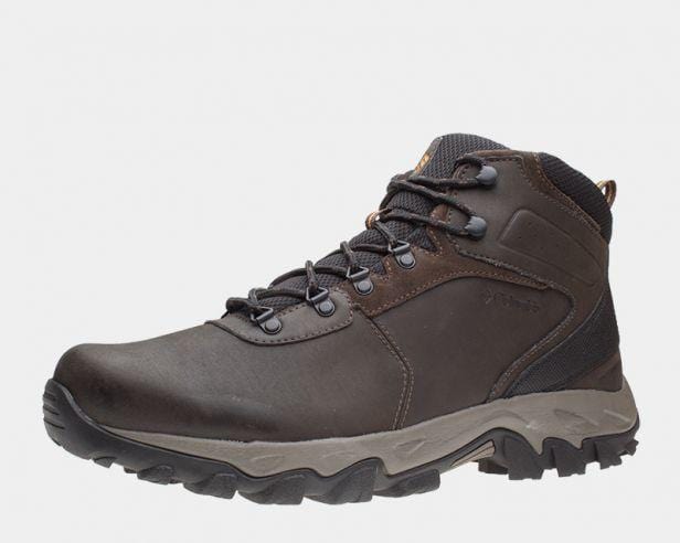 Columbia Newton Ridge Plus II Waterproof hiking boots in dark brown leather and black mesh with durable tread, side view.