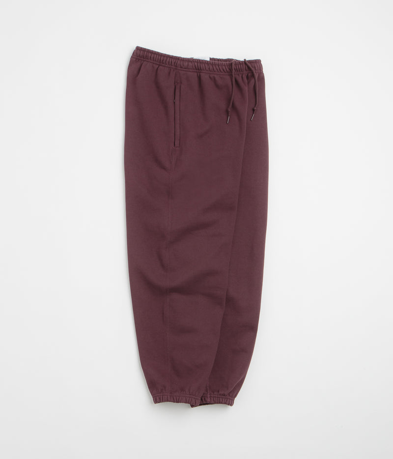 Nike Solo Swoosh Cuffed Sweatpants in Burgundy Crush and Burgundy Crush / White