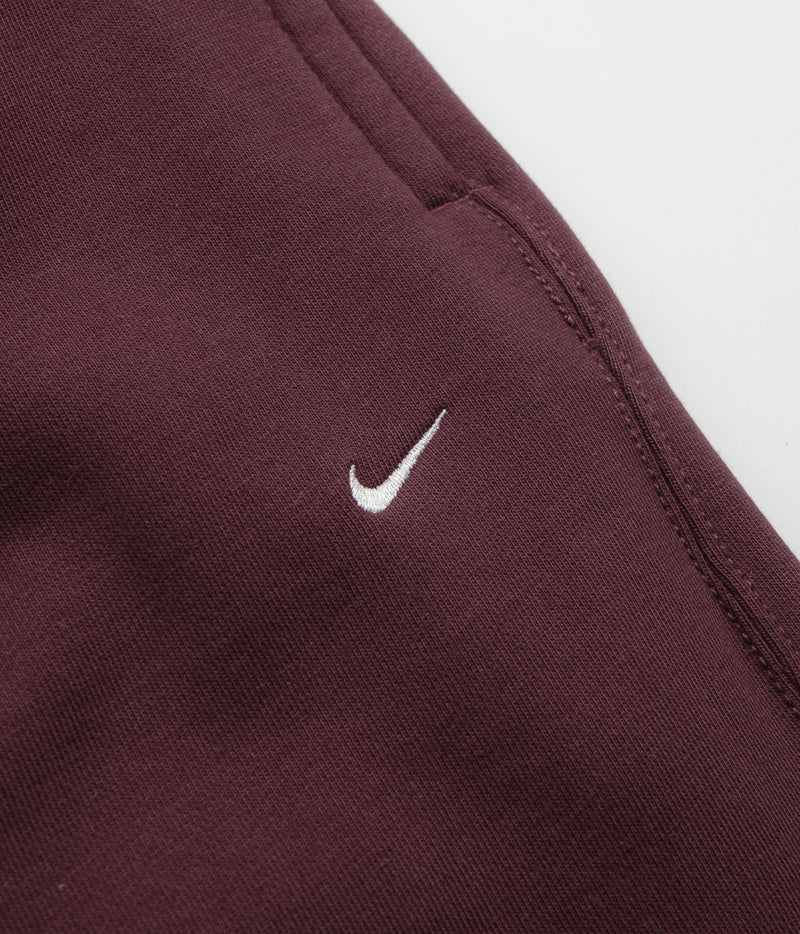 Nike Solo Swoosh Cuffed Sweatpants in Burgundy Crush and Burgundy Crush / White