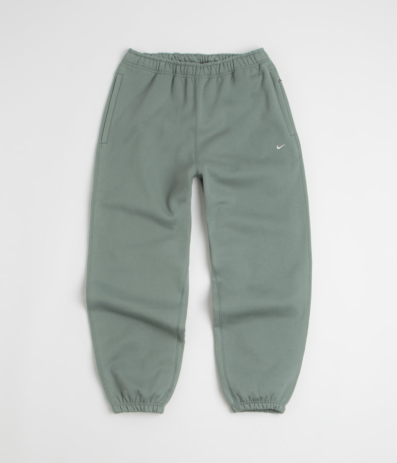 Nike Solo Swoosh Cuffed Sweatpants in Clay Green and Clay Green / White
