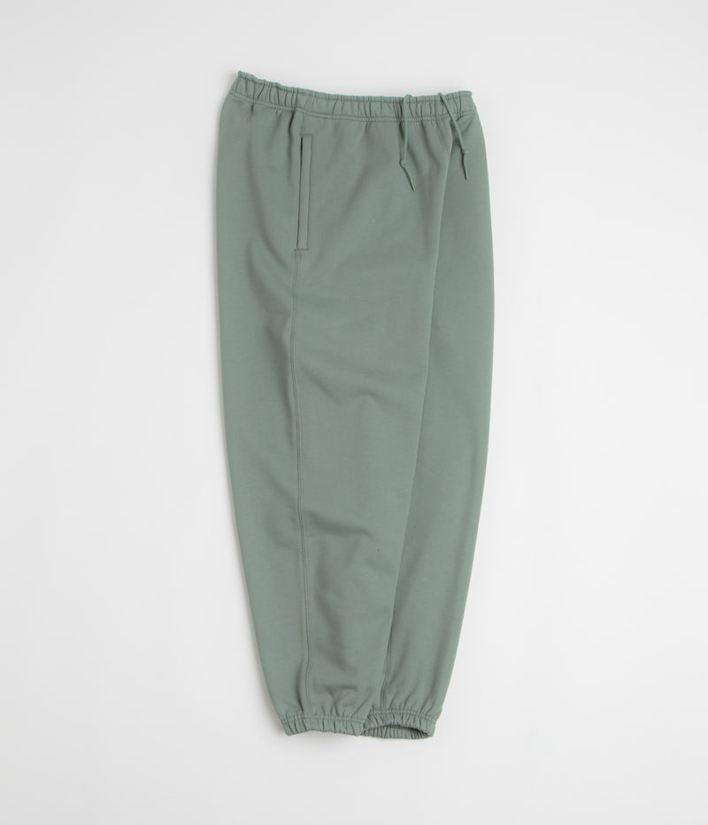 Nike Solo Swoosh Cuffed Sweatpants in Clay Green and Clay Green / White