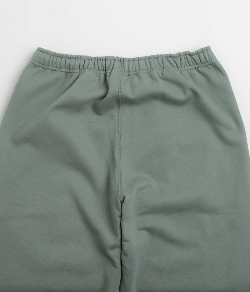 Nike Solo Swoosh Cuffed Sweatpants in Clay Green and Clay Green / White