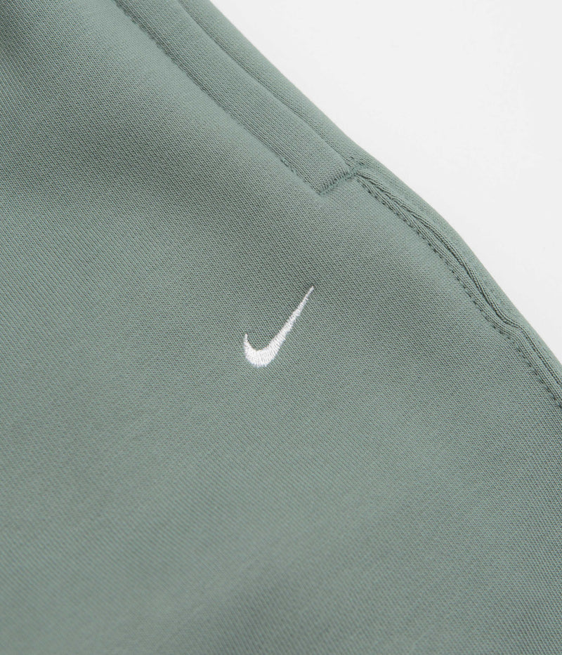 Nike Solo Swoosh Cuffed Sweatpants in Clay Green and Clay Green / White
