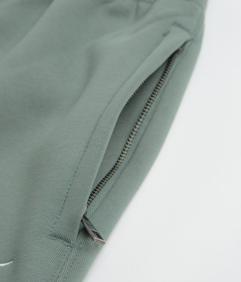 Nike Solo Swoosh Cuffed Sweatpants in Clay Green and Clay Green / White